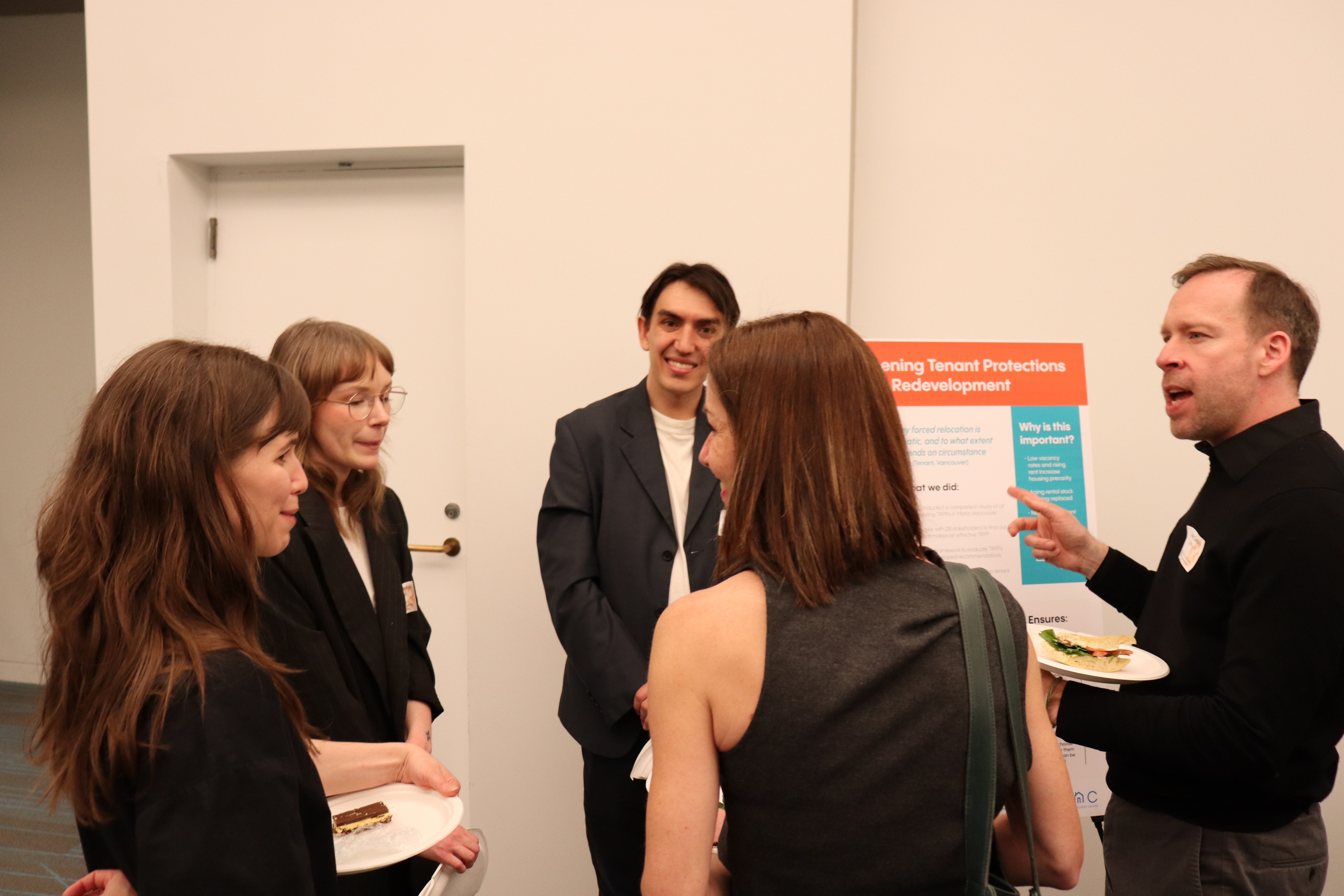 Faculty and students discuss projects over food