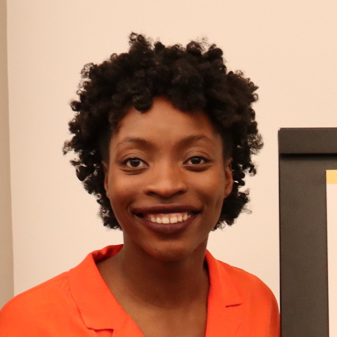 Student in profile with orange shirt