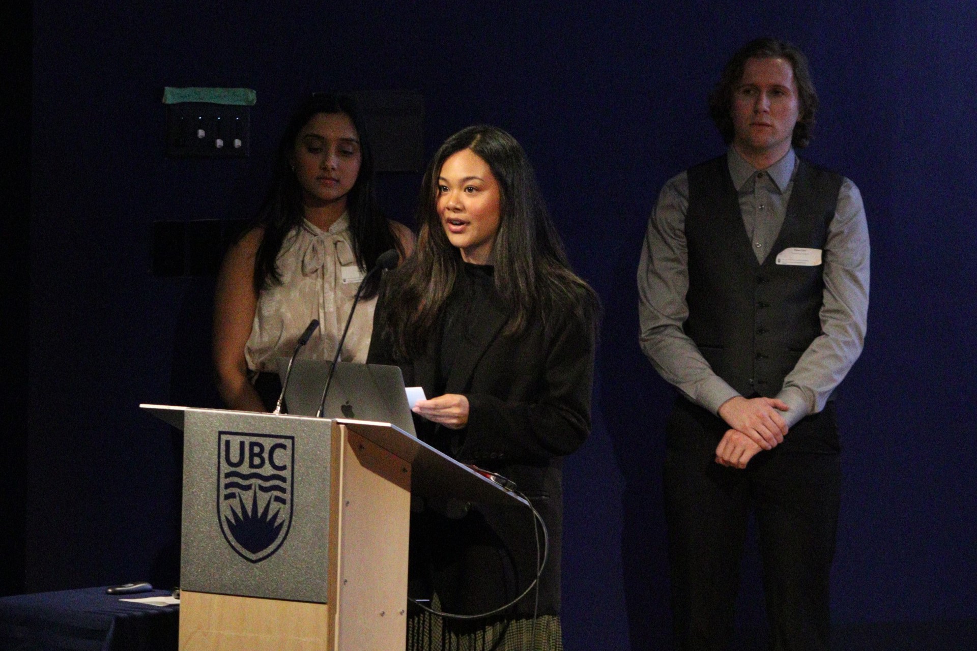 Students presenting at a lectern