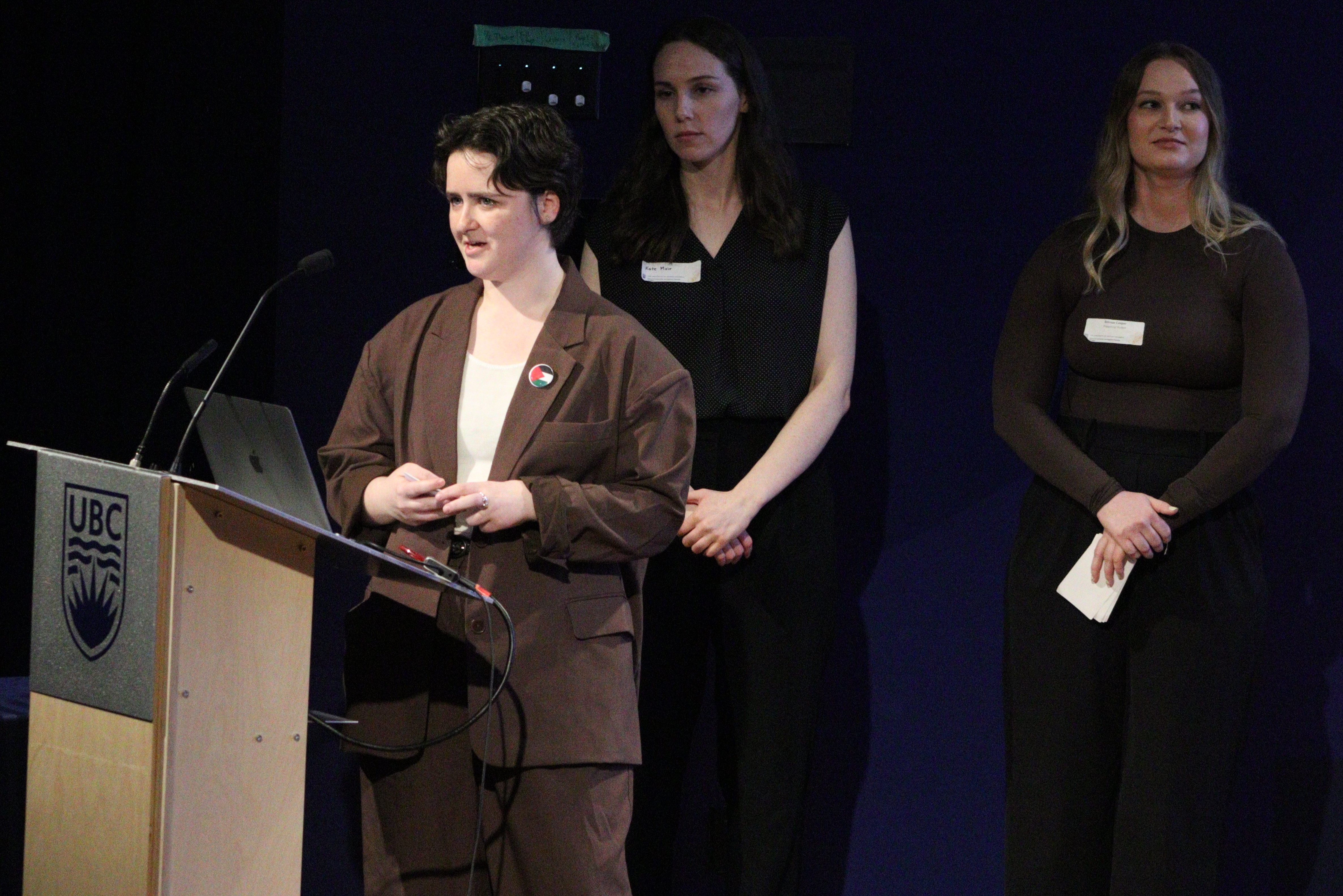 Students presenting at a lectern