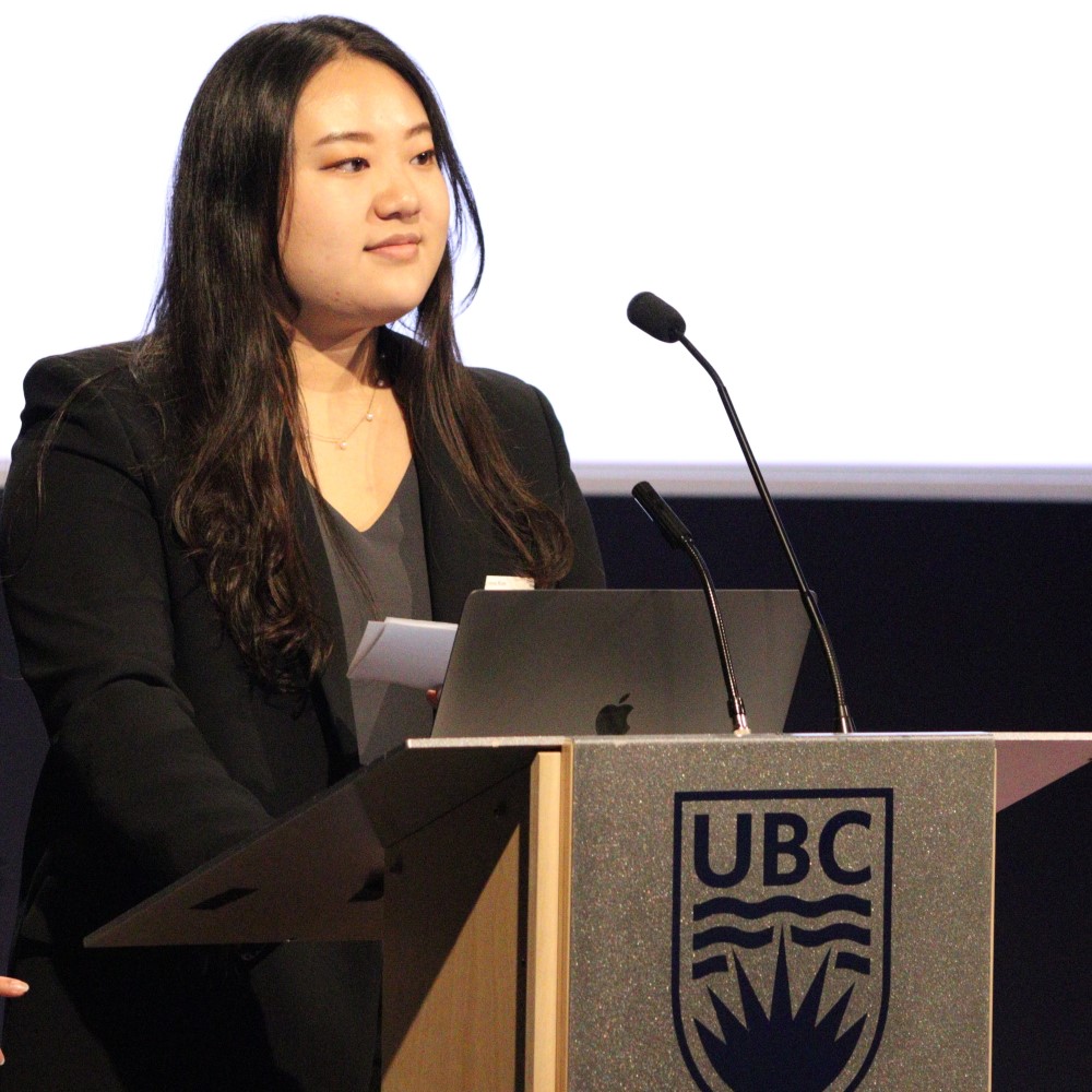 Student speaking at UBC lectern