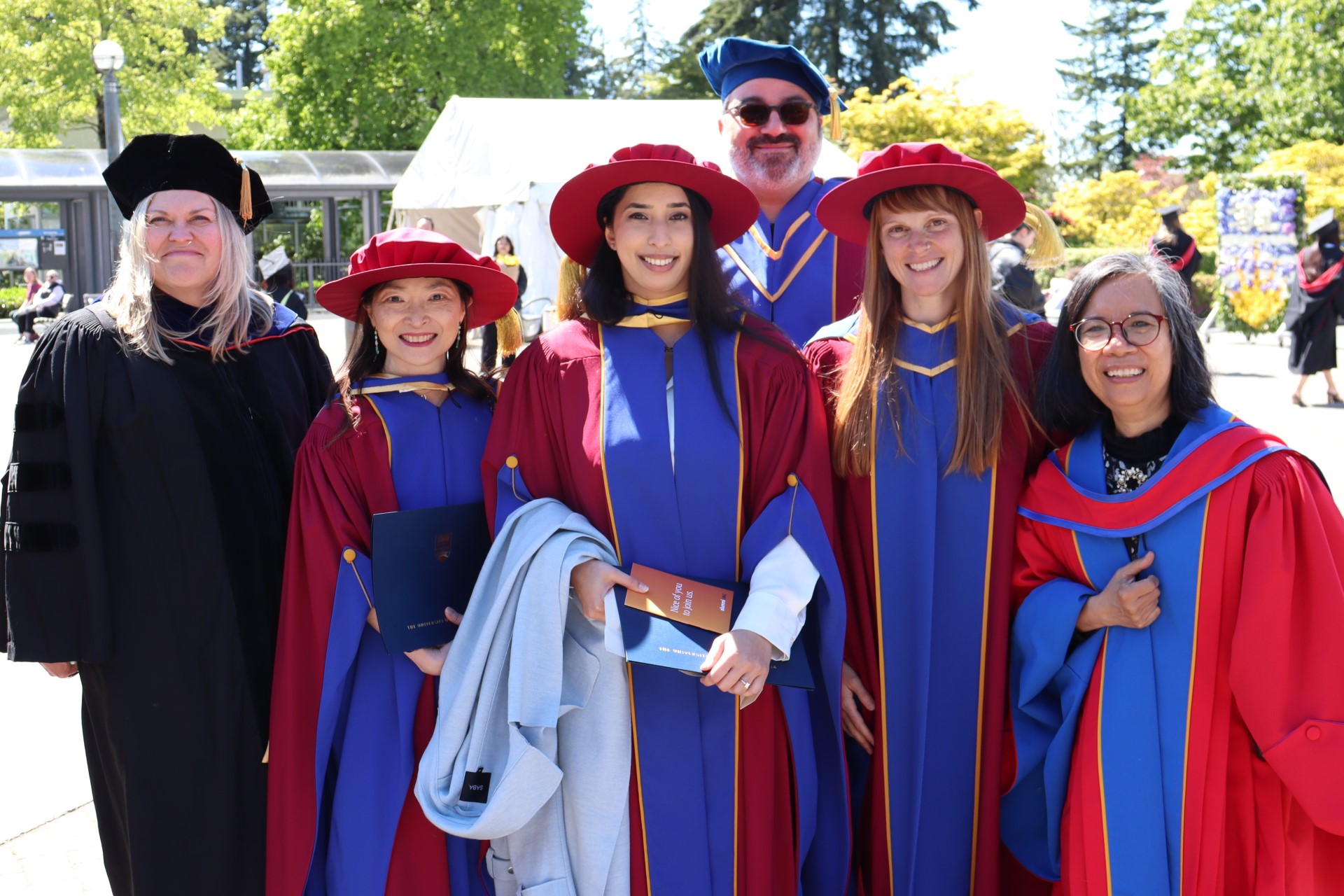 PhD grads and faculty in regalia