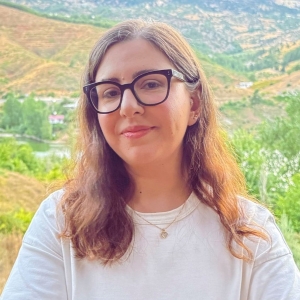 Woman with vast valley behind her