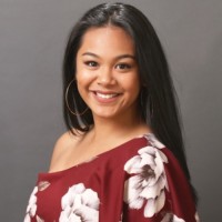Woman in red dress with white flower pattern