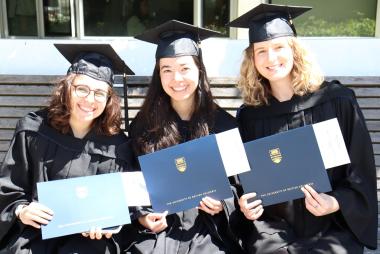 SCARP grads holding diplomas