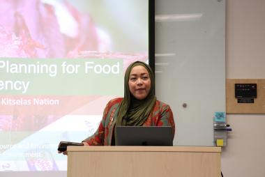 Woman giving talk at lectern