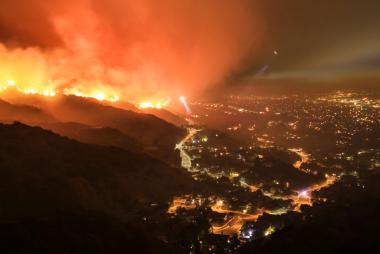 A wildfire nearby a town