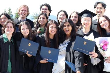 Grads posing in regalia together