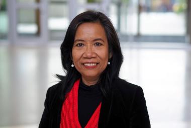 Woman in red top and black blazer