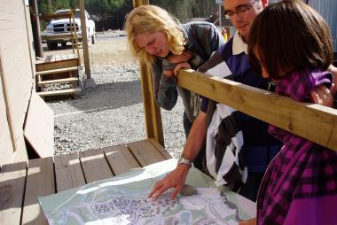 Students on-site overlooking a plan printout