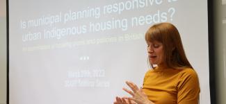Woman speaking at lectern
