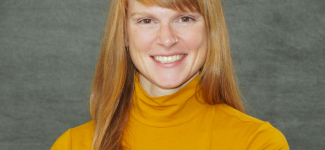 Woman in orange turtleneck