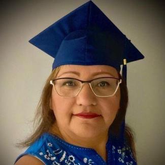 Woman with glasses and mortarboard