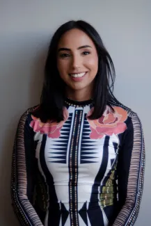 A woman in an ornate top