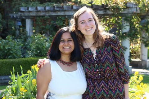 Meghna and Madison arm-in-arm in UBC's Rose Garden