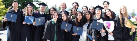 Grads posing in regalia together