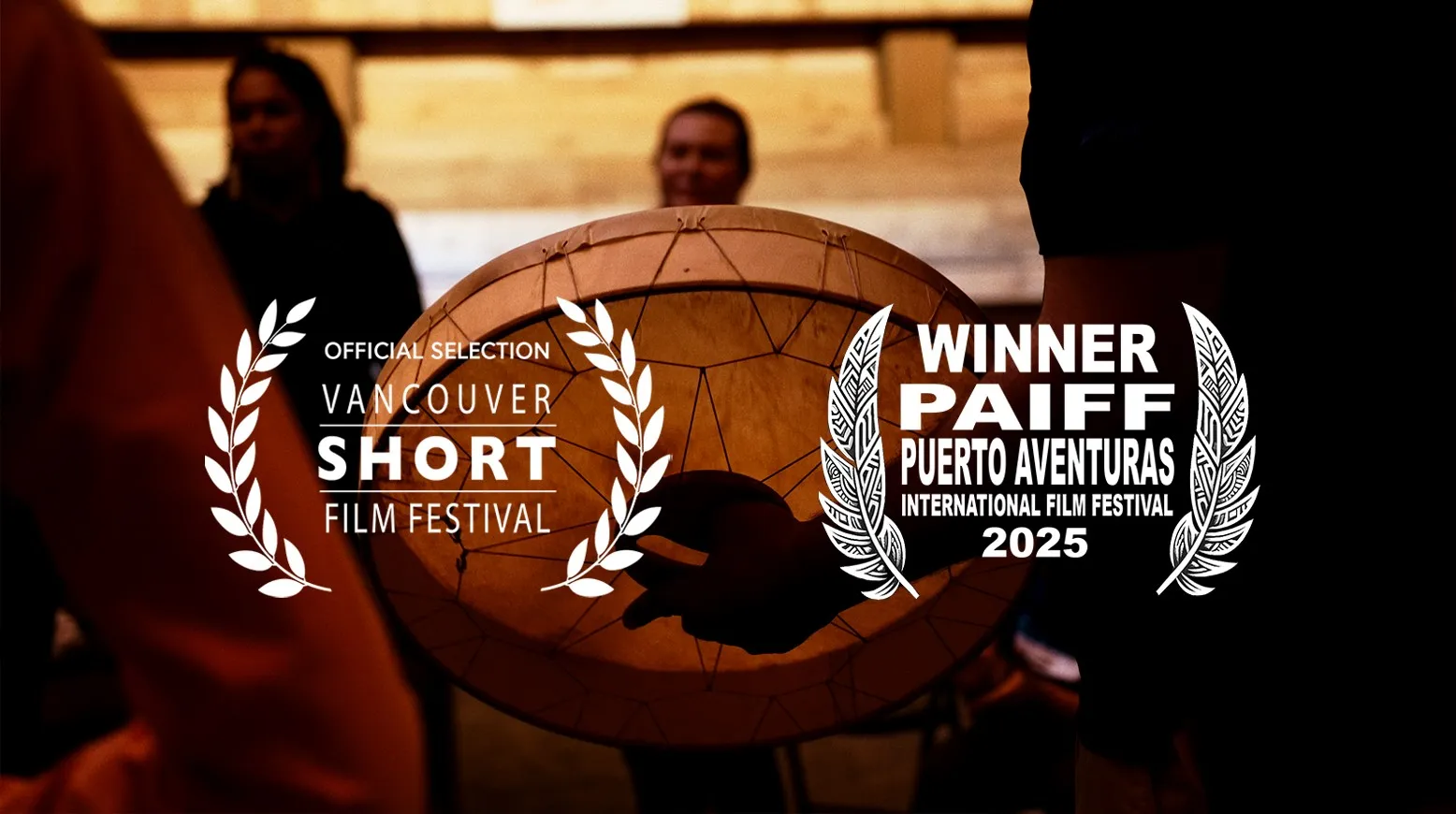 A traditional drum with people in the background, overlayed by two film awards