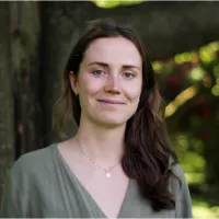 Jean, smiling among trees