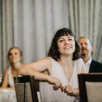 Tracy, sitting at gala audience table