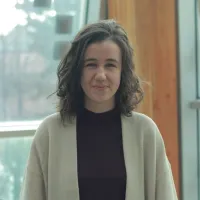 Profile of woman in sweater, near window