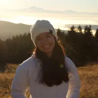 Profile of woman in hoodie out in mountain nature