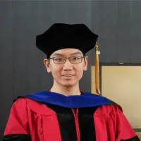 Man in PhD regalia