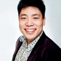 Man in blazer and patterned button-up shirt