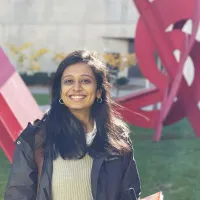 Woman outside among modernist sculptures